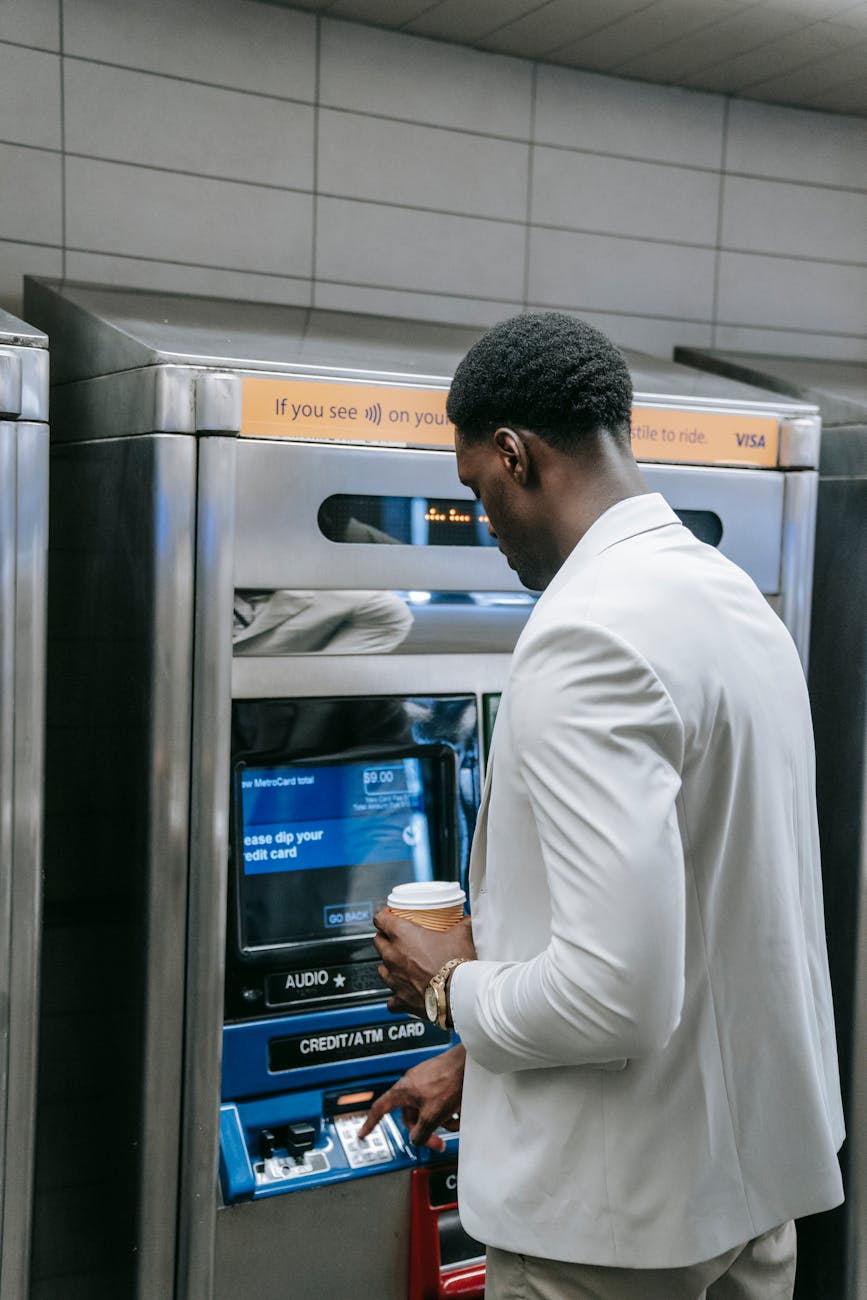 man using an automated teller machine